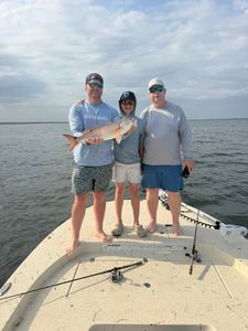 Successful redfish catch on fishing boat in Panacea FL waters
