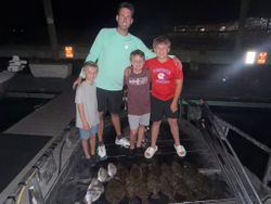 Four people fishing and hunting in Panacea
