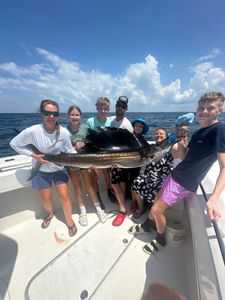 Angler holding a massive Atlantic Sailfish in Destin