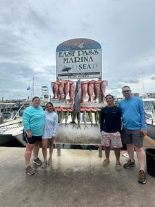 Four people enjoying a fishing trip in Destin