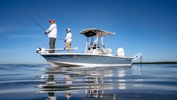 Fishing boat on calm water with anglers fishing from bow platform in Anchorage KY