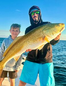 A photo of two people fishing in Pensacola