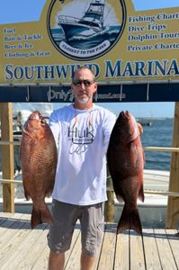 2 grey snapper caught while fishing in FL