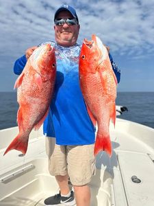 Angler with two fish in Pensacola