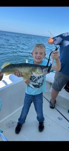 A person fishing at the lakeside in Marblehead