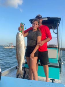 Trophy sized redfish catch by the power couple!