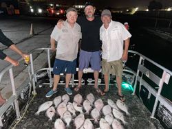 Five people enjoying a fishing trip at Port O'Connor