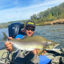Angler holding a 28-inch fish in Stanwood