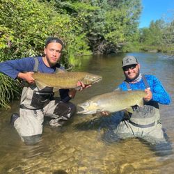 Two anglers enjoying a fishing trip in MI
