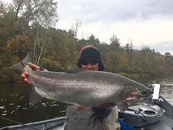 Fisherman with a large rainbow trout caught in Stanwood