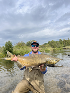 Nice catch on the fly rod! Partly cloudy conditions made for exciting fishing.