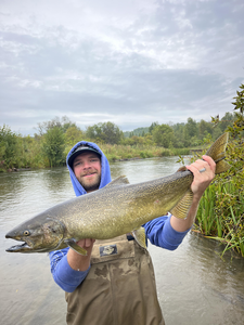 Great catch on a partly cloudy day using fly fishing technique!
