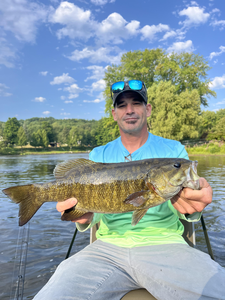 Landing a big Smallmouth Bass while fly fishing in Stanwood!