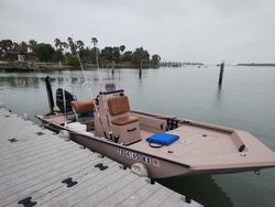 Fishing boat docked at marina in Corpus Christi TX with outboard motor and fishing equipment