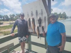 Redfish catch displayed on cleaning station after successful fishing trip in Corpus Christi TX