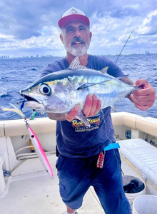 A lone angler reeling in a catch in New York