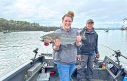 Angler with a rainbow trout catch in Rainier