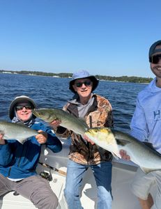 3 fishing enthusiasts in NC with their big catch