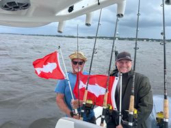 Two people enjoying a fishing tour in Oriental