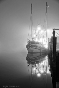Lights on the water, a day's catch in tow.