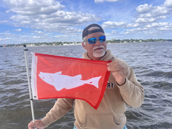 Light tackle adventure in Oriental waters - partly cloudy skies made for exciting fishing conditions!