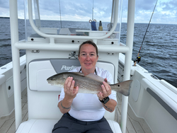 Light tackle triumph: A 14-inch redfish beauty!