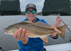Reeled in a big Redfish while navigating the clearing afternoon storms.