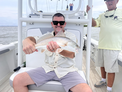 Light tackle magic lands a feisty redfish in Oriental!