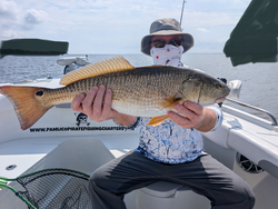 Snagged a feisty Redfish while battling the elements in Oriental, NC!