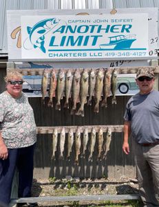 5 fishing rods with 2 people in the background at lakeside marblehead location