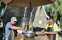 Two people fishing at the lakeside in Marblehead
