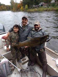Angler fishing for sea trout in Big Rapids
