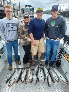 4 coho, pink, and chinook salmon caught while fishing in Big Rapids