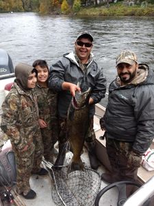 Four people fishing in Big Rapids