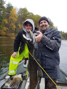 Two people enjoying a fishing trip in Michigan