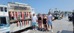 Clearing afternoon skies but storms may strike - no fish yet, but the group is determined to reel in the best catch!