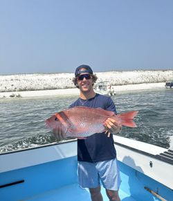 Red snapper catch displayed on fishing boat in Destin FL waters