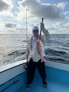 Reeled in a feisty 15-inch Red Snapper on a partly cloudy day!