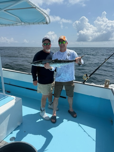 Hooked a massive Wahoo on a day of varied techniques under partly cloudy skies.