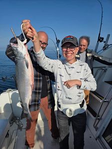 Fresh caught coho salmon displayed on fishing boat deck in Port Washington WI