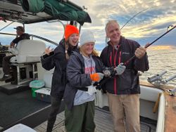 Charter fishing boat with fishing rods and equipment on deck in Port Washington WI waters
