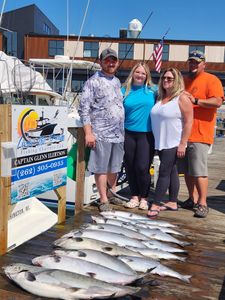 Fresh caught salmon displayed on dock after successful fishing charter in Port Washington WI