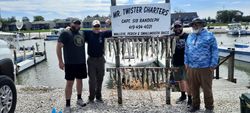 Four people fishing at Oak Harbor