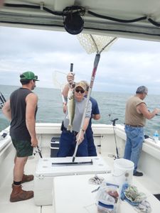 Angler holding a walleye fish in Oak Harbor