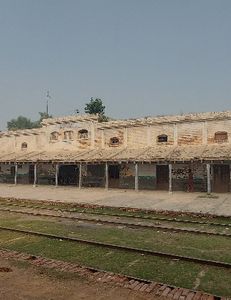 Historic train station building with railway tracks in foreground in Florida City FL