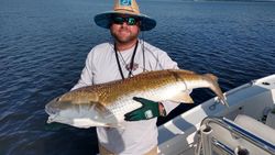 Angler with a large 28-inch fish, caught while fishing in New Bern