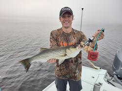 Reeling in a big Striped Bass using light tackle in New Bern!