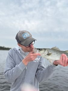 Nice striped bass on light tackle! Clear conditions made for an exciting adventure.