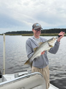 Nice striped bass on light tackle in New Bern! Clear conditions made for an exciting adventure.