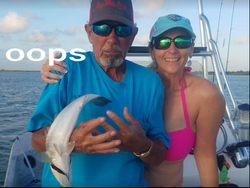 Two people fishing for a Blue Catfish in TX